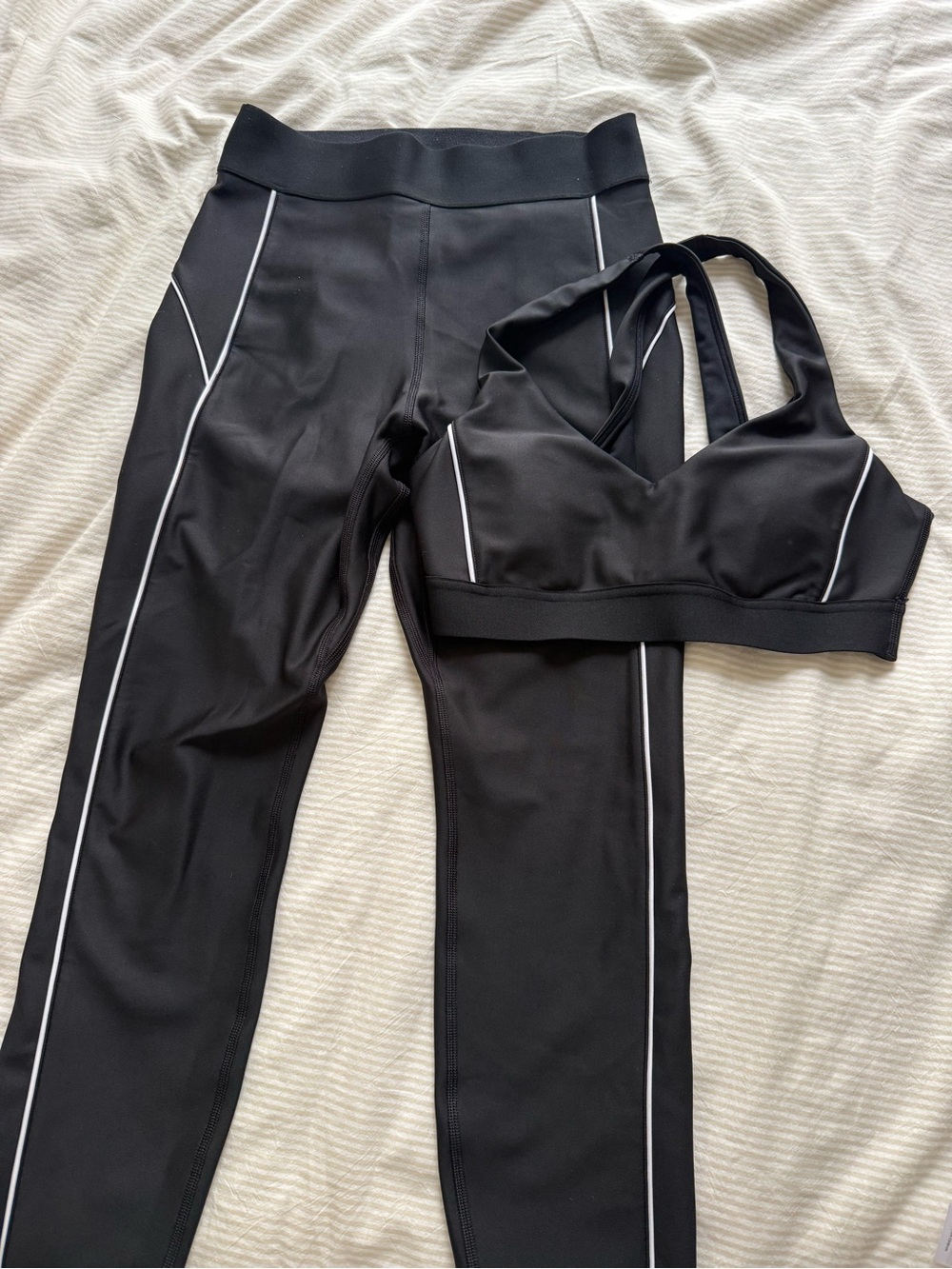 Matching set: Aritzia Black V-Neck Cross-Back Sports Bra and Leggings